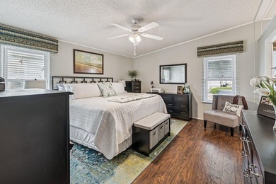 Welcome home to this beautifully updated 2-bedroom, 2-bath on Lake Henry Golf Club in Florida - for sale on GolfHomes.com, golf home, golf lot