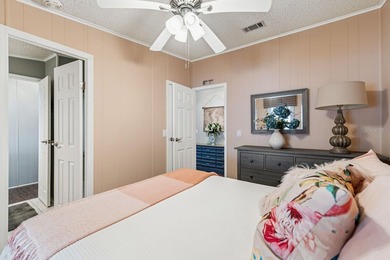 Welcome home to this beautifully updated 2-bedroom, 2-bath on Lake Henry Golf Club in Florida - for sale on GolfHomes.com, golf home, golf lot