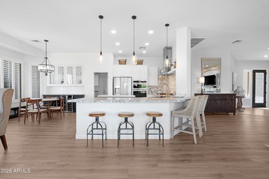 Set along the 10th hole in the prestigious 55+ guard-gated on Trilogy Golf Club At Power Ranch in Arizona - for sale on GolfHomes.com, golf home, golf lot