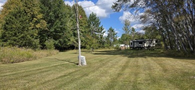 Welcome to Sugar Springs! This beautifully maintained dual lot on Sugar Springs Country Club in Michigan - for sale on GolfHomes.com, golf home, golf lot