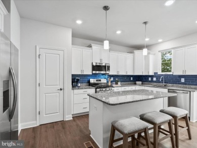 Welcome to 24325 Cassville Lane, a beautiful 3-story End Unit on Plantation Lakes Golf and Country Club in Delaware - for sale on GolfHomes.com, golf home, golf lot
