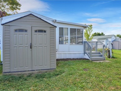 On a generous lot in Apple Island Resort, this furnished on Apple Island Golf Course At Apple Island Resort in Vermont - for sale on GolfHomes.com, golf home, golf lot