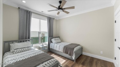 Welcome to 140 Utsesti Way! Discover contemporary elegance and on Toqua Golf Course - Loudon County in Tennessee - for sale on GolfHomes.com, golf home, golf lot