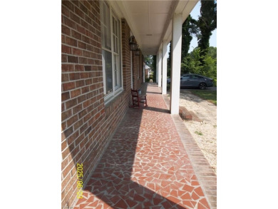 Well maintained brick ranch with a short walk between the hedges on Cypress Cove Country Club in Virginia - for sale on GolfHomes.com, golf home, golf lot