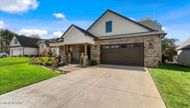 Welcome to 140 Utsesti Way! Discover contemporary elegance and on Toqua Golf Course - Loudon County in Tennessee - for sale on GolfHomes.com, golf home, golf lot