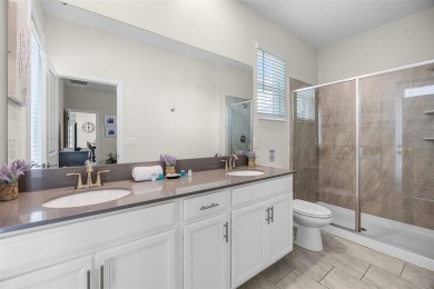 Step into resort-style living at 661 Drop Shot Drive, a on The Oasis Club at Champions Gate in Florida - for sale on GolfHomes.com, golf home, golf lot