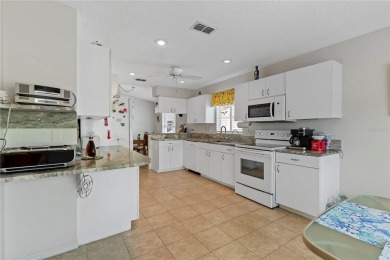 As you enter the enclosed entryway and step into the foyer the on Scepter Golf Club in Florida - for sale on GolfHomes.com, golf home, golf lot