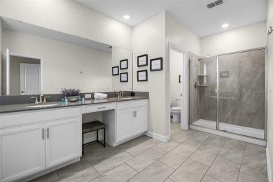 Step into resort-style living at 661 Drop Shot Drive, a on The Oasis Club at Champions Gate in Florida - for sale on GolfHomes.com, golf home, golf lot