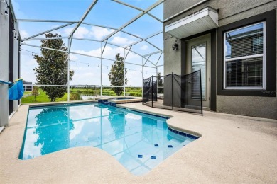 Step into resort-style living at 661 Drop Shot Drive, a on The Oasis Club at Champions Gate in Florida - for sale on GolfHomes.com, golf home, golf lot