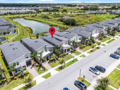 Step into resort-style living at 661 Drop Shot Drive, a on The Oasis Club at Champions Gate in Florida - for sale on GolfHomes.com, golf home, golf lot