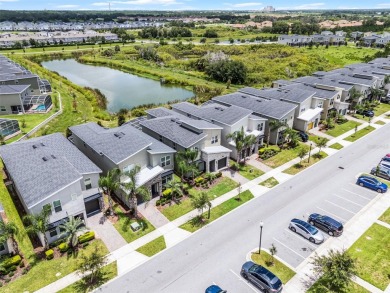 Step into resort-style living at 661 Drop Shot Drive, a on The Oasis Club at Champions Gate in Florida - for sale on GolfHomes.com, golf home, golf lot
