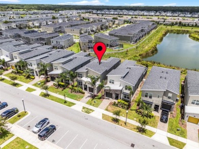 Step into resort-style living at 661 Drop Shot Drive, a on The Oasis Club at Champions Gate in Florida - for sale on GolfHomes.com, golf home, golf lot