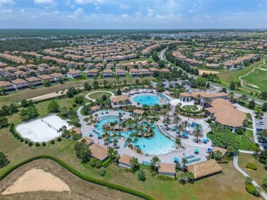 Step into resort-style living at 661 Drop Shot Drive, a on The Oasis Club at Champions Gate in Florida - for sale on GolfHomes.com, golf home, golf lot