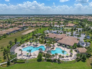 Step into resort-style living at 661 Drop Shot Drive, a on The Oasis Club at Champions Gate in Florida - for sale on GolfHomes.com, golf home, golf lot