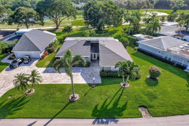 This stunning home boasts a bright and expansive great room with on Eastpointe Country Club in Florida - for sale on GolfHomes.com, golf home, golf lot