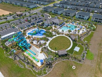 Step into resort-style living at 661 Drop Shot Drive, a on The Oasis Club at Champions Gate in Florida - for sale on GolfHomes.com, golf home, golf lot