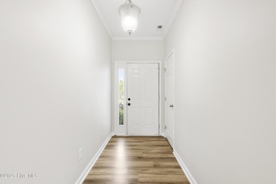 Step into this beautifully renovated home in the highly on Magnolia Greens Golf Plantation in North Carolina - for sale on GolfHomes.com, golf home, golf lot