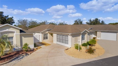 This meticulously maintained 2/2 Block/Stucco WOODLAWN Courtyard on The Links of Spruce Creek in Florida - for sale on GolfHomes.com, golf home, golf lot