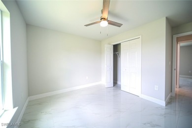 INTERSECTING CANAL VIEWS! You Will Be Amazed By The Quality Of on Mirror Lakes Golf Club in Florida - for sale on GolfHomes.com, golf home, golf lot