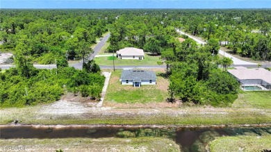INTERSECTING CANAL VIEWS! You Will Be Amazed By The Quality Of on Mirror Lakes Golf Club in Florida - for sale on GolfHomes.com, golf home, golf lot