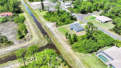 INTERSECTING CANAL VIEWS! You Will Be Amazed By The Quality Of on Mirror Lakes Golf Club in Florida - for sale on GolfHomes.com, golf home, golf lot
