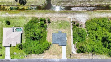 INTERSECTING CANAL VIEWS! You Will Be Amazed By The Quality Of on Mirror Lakes Golf Club in Florida - for sale on GolfHomes.com, golf home, golf lot