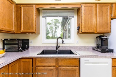 Haslett: Rare offering for this Immaculate 1,700+- sq. ft on Meridian Sun Golf Club in Michigan - for sale on GolfHomes.com, golf home, golf lot