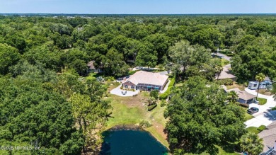 Experience luxury & tranquility in this stunning single-story on Magnolia Point Golf and Country Club in Florida - for sale on GolfHomes.com, golf home, golf lot