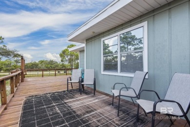 Cute, well-maintained, and updated 2-bedroom home is located on Kiva Dunes Golf Club in Alabama - for sale on GolfHomes.com, golf home, golf lot