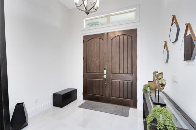 Welcome to an architectural gem in the esteemed Eagle Creek on Eagle Creek Golf Club in Florida - for sale on GolfHomes.com, golf home, golf lot