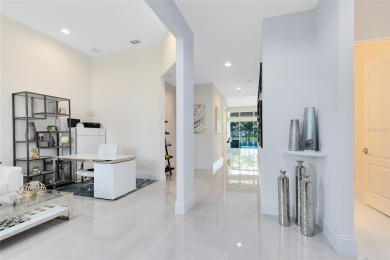 Welcome to an architectural gem in the esteemed Eagle Creek on Eagle Creek Golf Club in Florida - for sale on GolfHomes.com, golf home, golf lot