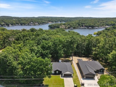 Enjoy a crisp morning sipping your morning coffee and watching on Tan-Tar-A Golf Club in Missouri - for sale on GolfHomes.com, golf home, golf lot