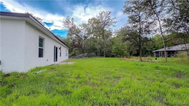 Check out this amazing 4-bedroom home in Citrus Springs! If on Citrus Springs Country Club in Florida - for sale on GolfHomes.com, golf home, golf lot