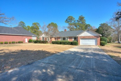 This charming brick ranch home is located in a prestigious gated on Santee-Cooper Country Club in South Carolina - for sale on GolfHomes.com, golf home, golf lot