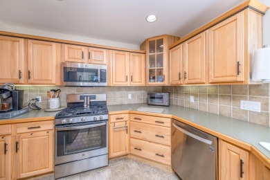 Enjoy stunning golf course views from this meticulously on Canadian Lakes Country Club-The Royal Course in Michigan - for sale on GolfHomes.com, golf home, golf lot