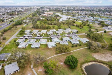 Under contract-accepting backup offers. Affordable end unit on Kings Point Executive Golf Course in Florida - for sale on GolfHomes.com, golf home, golf lot