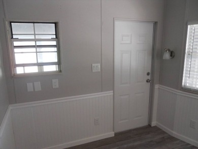 Charming two bedroom, one and a half bathroom home in the Bass on Polo Park East in Florida - for sale on GolfHomes.com, golf home, golf lot