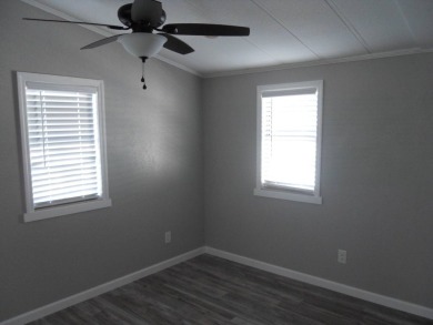 Charming two bedroom, one and a half bathroom home in the Bass on Polo Park East in Florida - for sale on GolfHomes.com, golf home, golf lot