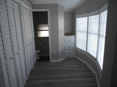 Charming two bedroom, one and a half bathroom home in the Bass on Polo Park East in Florida - for sale on GolfHomes.com, golf home, golf lot