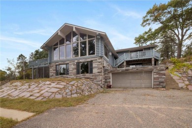 Take a look at this Pelican Lake log cabin, situated on the 19th on Breezy Point Golf Course Resort in Minnesota - for sale on GolfHomes.com, golf home, golf lot