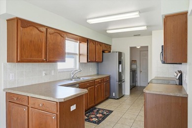 Enjoy easy Florida living in this beautifully maintained and on Highland Fairways Golf Club in Florida - for sale on GolfHomes.com, golf home, golf lot