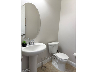 THIS LOVELY HOME IS A MUST SEE TO BELIEVE! This Meticulously on Gateway Golf and Country Club in Florida - for sale on GolfHomes.com, golf home, golf lot