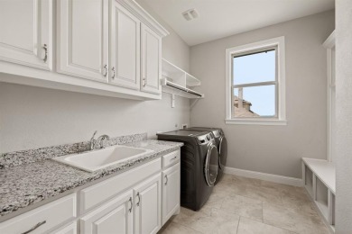 Welcome to this immaculate former model home, nestled on a on The Golf Club at Resort Eagle Mountain Lake in Texas - for sale on GolfHomes.com, golf home, golf lot