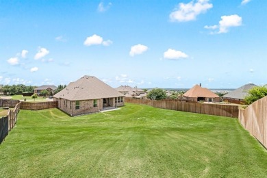 Welcome to this immaculate former model home, nestled on a on The Golf Club at Resort Eagle Mountain Lake in Texas - for sale on GolfHomes.com, golf home, golf lot