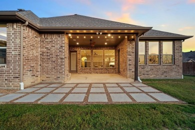 Welcome to this immaculate former model home, nestled on a on The Golf Club at Resort Eagle Mountain Lake in Texas - for sale on GolfHomes.com, golf home, golf lot