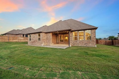 Welcome to this immaculate former model home, nestled on a on The Golf Club at Resort Eagle Mountain Lake in Texas - for sale on GolfHomes.com, golf home, golf lot
