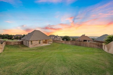 Welcome to this immaculate former model home, nestled on a on The Golf Club at Resort Eagle Mountain Lake in Texas - for sale on GolfHomes.com, golf home, golf lot