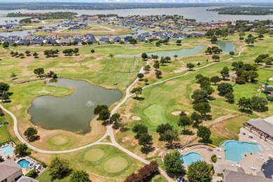 Welcome to this immaculate former model home, nestled on a on The Golf Club at Resort Eagle Mountain Lake in Texas - for sale on GolfHomes.com, golf home, golf lot