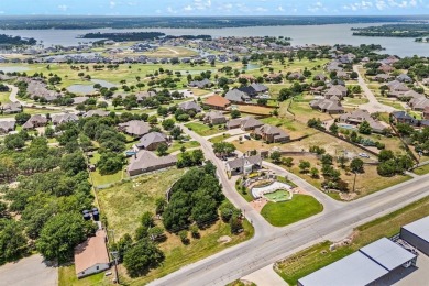 Welcome to this immaculate former model home, nestled on a on The Golf Club at Resort Eagle Mountain Lake in Texas - for sale on GolfHomes.com, golf home, golf lot