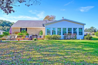 What an incredible find! Nestled on a spacious lot along Hole 12 on Santee-Cooper Country Club in South Carolina - for sale on GolfHomes.com, golf home, golf lot